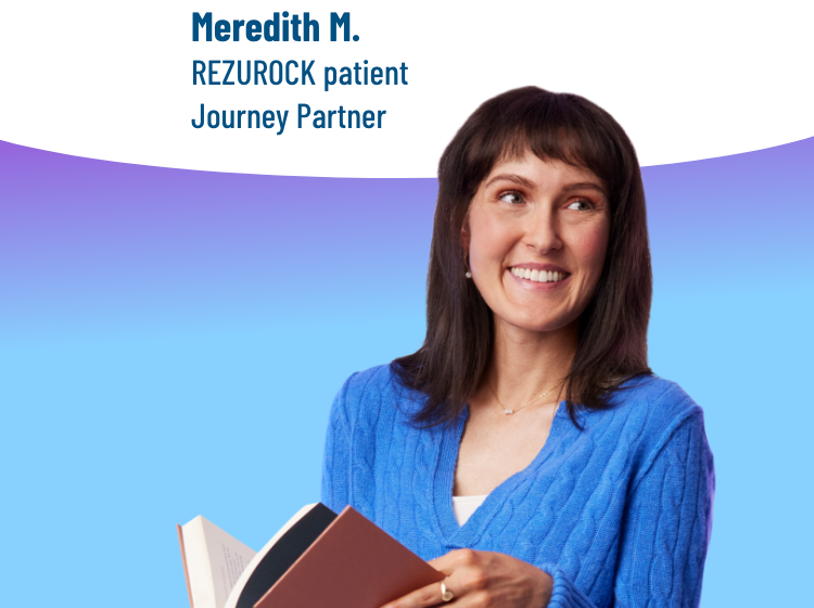 A woman holding a book and standing